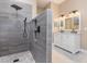 Modern bathroom with a large walk-in shower and double vanity at 2807 Strand Loop Ct, Oviedo, FL 32765