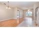 Spacious living room with laminate wood floors and an archway at 2807 Strand Loop Ct, Oviedo, FL 32765