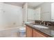 Clean bathroom with granite countertop, large mirror and shower/tub combo at 2807 Strand Loop Ct, Oviedo, FL 32765