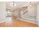 Spacious living room with laminate wood floors and an archway at 2807 Strand Loop Ct, Oviedo, FL 32765