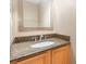 Bathroom featuring granite countertop and light wood vanity at 2807 Strand Loop Ct, Oviedo, FL 32765