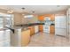 Kitchen with light wood cabinets, granite countertops, and stainless steel appliances at 2807 Strand Loop Ct, Oviedo, FL 32765