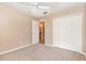 Well-lit bedroom featuring carpet, a double-door closet, and access to the bathroom at 2807 Strand Loop Ct, Oviedo, FL 32765