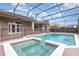 Inviting screened pool and spa with fenced backyard at 2807 Strand Loop Ct, Oviedo, FL 32765