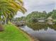 Waterfront property with a wooden dock and calm water at 16 Cypress Dr, Eustis, FL 32726