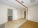 Unfinished interior with exposed beams and flooring at 16 Cypress Dr, Eustis, FL 32726