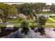Waterfront home with private dock and mature landscaping at 16 Cypress Dr, Eustis, FL 32726