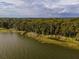 Aerial view of a waterfront property with several docks at 16 Cypress Dr, Eustis, FL 32726