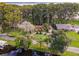 Aerial view of a waterfront house with a long driveway at 16 Cypress Dr, Eustis, FL 32726