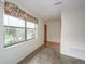 Living Room with large window overlooking the outdoors at 16 Cypress Dr, Eustis, FL 32726