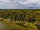 Aerial view showing waterfront property with multiple docks at 16 Cypress Dr, Eustis, FL 32726