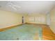 Large living room featuring hardwood floors and ceiling fans at 16 Cypress Dr, Eustis, FL 32726