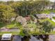 Aerial view of a waterfront house with a long driveway at 16 Cypress Dr, Eustis, FL 32726
