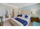 Main bedroom with king-size bed, ample closet space, and ensuite bathroom at 4751 Clock Tower Dr # 105, Kissimmee, FL 34746