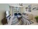 Bright and airy living room features comfortable seating and a large TV at 4751 Clock Tower Dr # 105, Kissimmee, FL 34746