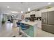 Open concept kitchen with island and breakfast bar, stainless steel appliances at 4751 Clock Tower Dr # 105, Kissimmee, FL 34746