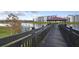 Wooden dock with gazebo and lake access for kayaks at 4751 Clock Tower Dr # 105, Kissimmee, FL 34746