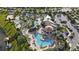 Aerial view of resort-style pool, water park, and clubhouse at 4751 Clock Tower Dr # 105, Kissimmee, FL 34746