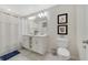 Clean bathroom with double vanity, bathtub, and updated fixtures at 4751 Clock Tower Dr # 105, Kissimmee, FL 34746