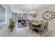 Spacious living room with comfortable seating, large windows, and dining area at 4751 Clock Tower Dr # 105, Kissimmee, FL 34746