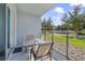 Private patio with table and chairs, overlooking a green space at 4751 Clock Tower Dr # 105, Kissimmee, FL 34746