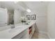 Double vanity bathroom with plenty of cabinet space and a large shower at 4751 Clock Tower Dr # 105, Kissimmee, FL 34746