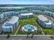 Complex-wide aerial view, showing the pool and buildings at 4751 Clock Tower Dr # 105, Kissimmee, FL 34746