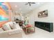Living room with open concept floor plan and adjacent dining area at 3074 Key Lime Loop, Kissimmee, FL 34747