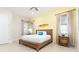 Main bedroom with a king-size bed and beach decor at 3074 Key Lime Loop, Kissimmee, FL 34747