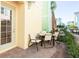 Private patio with table and chairs, perfect for outdoor dining at 3074 Key Lime Loop, Kissimmee, FL 34747