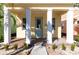 Front entrance with covered porch and light teal door at 3074 Key Lime Loop, Kissimmee, FL 34747