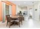 Kitchen dining area with wooden table and chairs at 3074 Key Lime Loop, Kissimmee, FL 34747