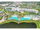 Aerial view of resort with large pool and buildings at 3074 Key Lime Loop, Kissimmee, FL 34747