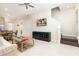 Bright living room features a comfortable sofa, coffee table, and large TV at 3074 Key Lime Loop, Kissimmee, FL 34747