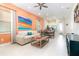Open living area with comfortable sofa, coffee table, and dining area at 3074 Key Lime Loop, Kissimmee, FL 34747