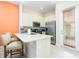 Modern kitchen with a breakfast bar and stainless steel appliances at 3074 Key Lime Loop, Kissimmee, FL 34747