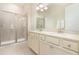 Double vanity bathroom with a large shower at 3074 Key Lime Loop, Kissimmee, FL 34747