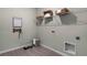 Convenient laundry room with shelving and pet supplies at 3517 Sandalwood Isle Way, Ocoee, FL 34761