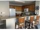 Kitchen with breakfast bar and wood cabinets at 13427 Blue Heron Beach Dr # 501, Orlando, FL 32821