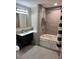 Clean bathroom with soaking tub and shower at 13427 Blue Heron Beach Dr # 501, Orlando, FL 32821