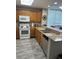 Well-equipped kitchen with wood cabinets and granite counters at 13427 Blue Heron Beach Dr # 501, Orlando, FL 32821