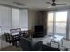 Living room with lake view and dining area at 13427 Blue Heron Beach Dr # 501, Orlando, FL 32821