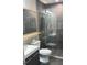 Modern bathroom with a glass shower and gray tile at 13427 Blue Heron Beach Dr # 501, Orlando, FL 32821