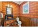 Powder room with wood-paneled walls and unique sink at 1041 Cottontail Ln, Maitland, FL 32751