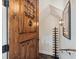 Elegant entryway with a rustic wood door and black accents at 1041 Cottontail Ln, Maitland, FL 32751