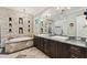 Elegant bathroom with double vanity and a soaking tub at 1041 Cottontail Ln, Maitland, FL 32751