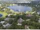 Aerial view of house and surrounding lake at 1041 Cottontail Ln, Maitland, FL 32751