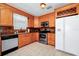 Kitchen features wood cabinets, stainless steel appliances, and tile flooring at 250 White Marsh Cir, Orlando, FL 32824
