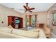 Living room features neutral colors, comfy seating, and a large TV at 250 White Marsh Cir, Orlando, FL 32824