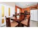 Bright kitchen with wood cabinets, stainless steel appliances, and a breakfast nook at 250 White Marsh Cir, Orlando, FL 32824